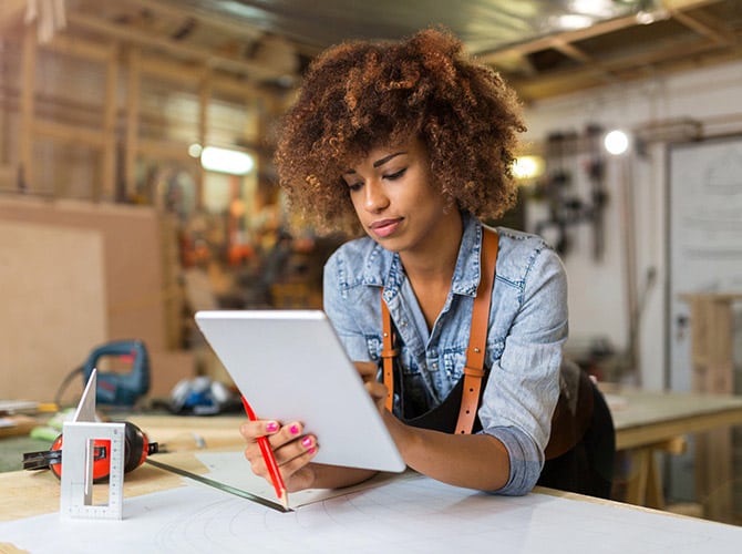 Woman working on an iPad 